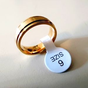 Size 6 Gold Titanium Unisex Band Ring. New. Opened only for photographing. Makes
